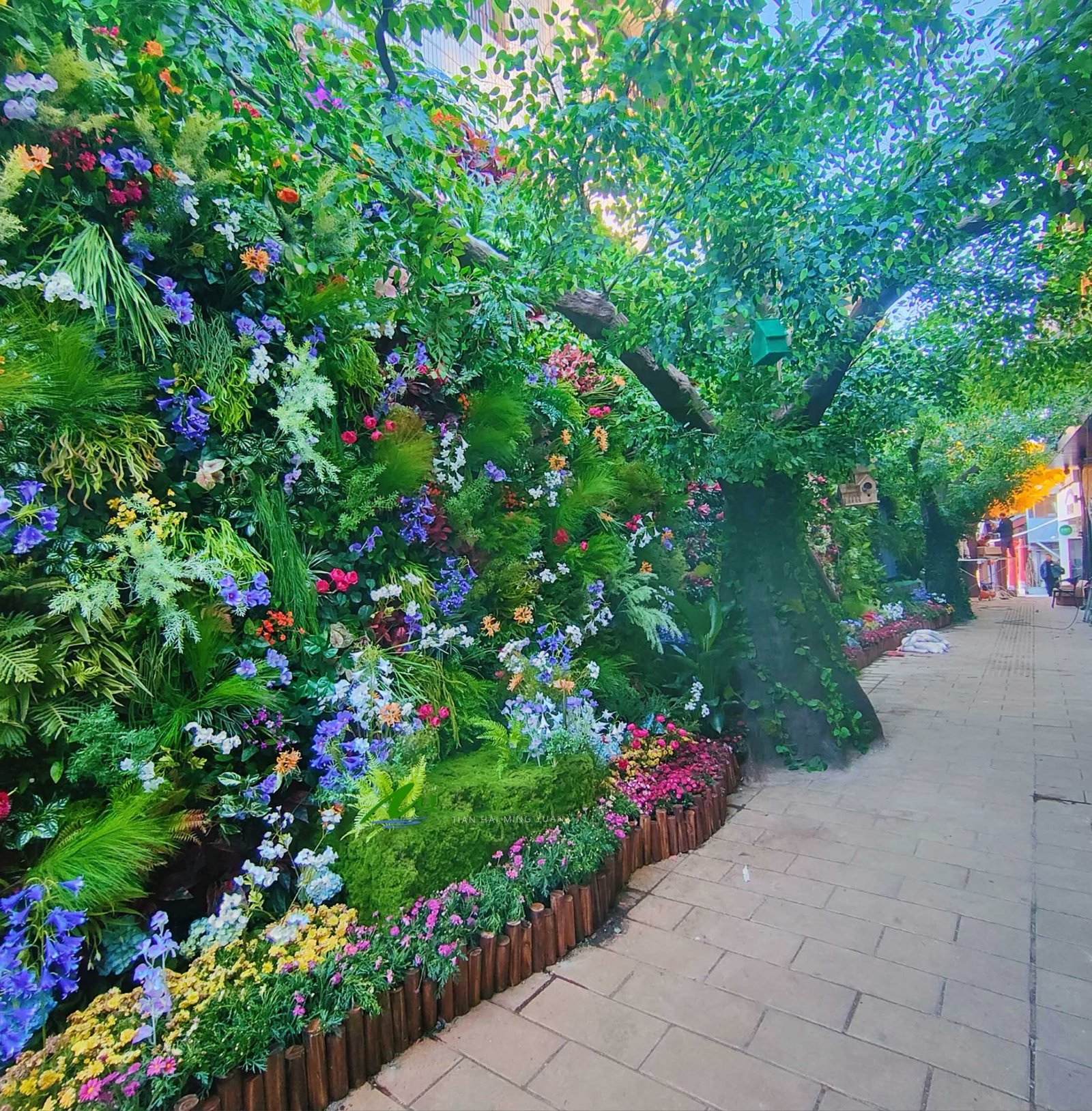 The Fusion of Artificial Green Wall and Large Cement Fake Trees